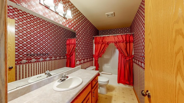 120 6th St SW, Chatfield, MN 55923 - full bath with wallpapered walls, tile patterned floors, vanity, and shower / bath combo