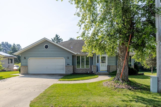 120 6th St SW, Chatfield, MN 55923 - view of front facade with brick siding, an attached garage, concrete driveway, and a front yard