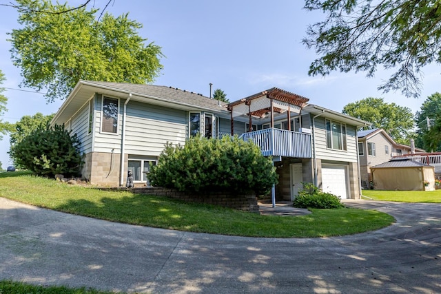 120 6th St SW, Chatfield, MN 55923 - view of front of house featuring asphalt driveway, a garage, and a front yard