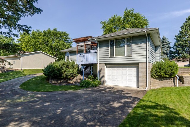 120 6th St SW, Chatfield, MN 55923 - view of front of property with driveway, an attached garage, and a front yard