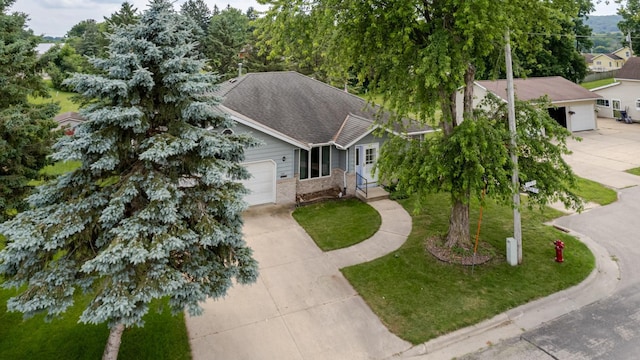 120 6th St SW, Chatfield, MN 55923 - ranch-style home featuring concrete driveway, an attached garage, brick siding, and a front lawn