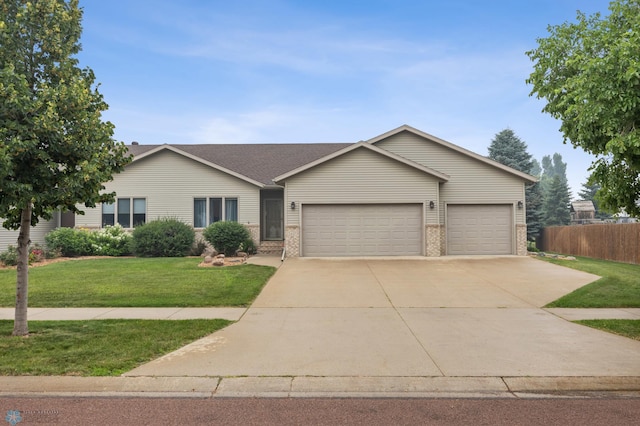 3437 26th Ave S, Fargo, ND 58103 - ranch-style house with an attached garage, brick siding, and driveway