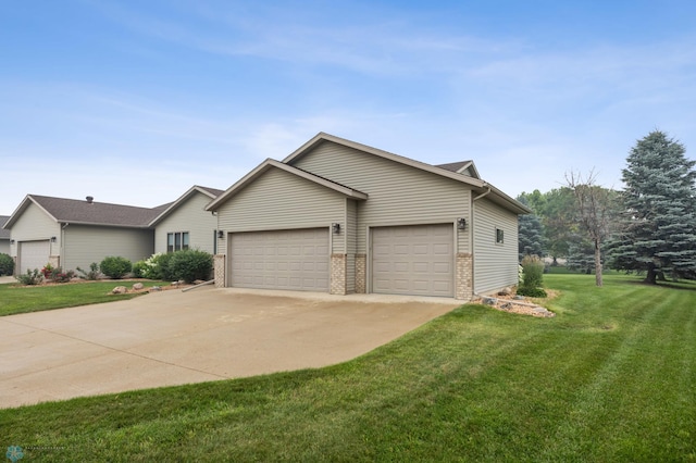3437 26th Ave S, Fargo, ND 58103 - view of front of house with a garage, a front lawn, concrete driveway, and brick siding