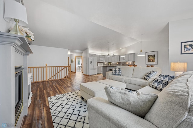 3437 26th Ave S, Fargo, ND 58103 - living room with lofted ceiling and dark wood-style floors
