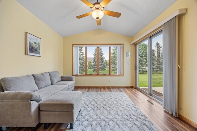 3437 26th Ave S, Fargo, ND 58103 - living area with vaulted ceiling, wood finished floors, and ceiling fan