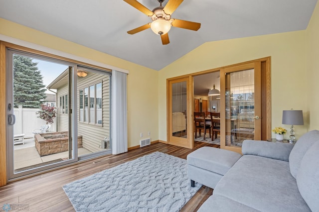 3437 26th Ave S, Fargo, ND 58103 - living room with wood finished floors, vaulted ceiling, and ceiling fan