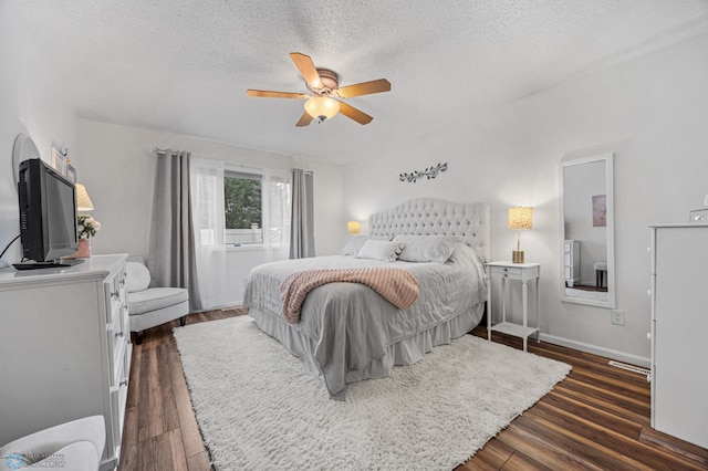 3437 26th Ave S, Fargo, ND 58103 - bedroom featuring a textured ceiling, dark wood-style floors, and a ceiling fan