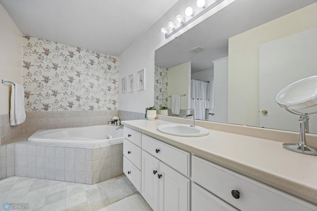 3437 26th Ave S, Fargo, ND 58103 - full bathroom featuring wallpapered walls, a garden tub, tile patterned flooring, and vanity
