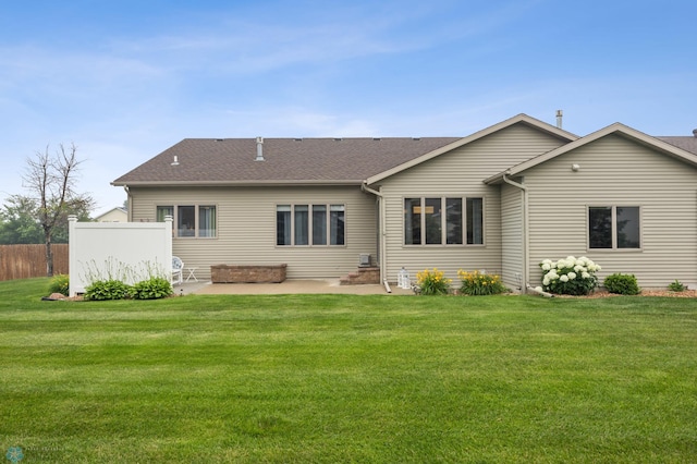 3437 26th Ave S, Fargo, ND 58103 - back of property with a patio area and a shingled roof