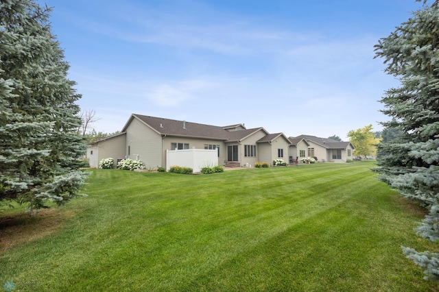 3437 26th Ave S, Fargo, ND 58103 - rear view of house featuring a yard