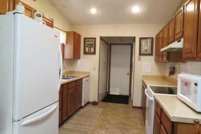 912 3rd St N Unit 7, Cold Spring, MN 56320 - kitchen featuring white appliances, under cabinet range hood, backsplash, brown cabinetry, and recessed lighting