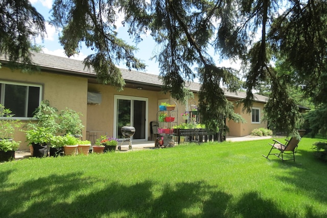 912 3rd St N Unit 7, Cold Spring, MN 56320 - rear view of property featuring stucco siding and a lawn