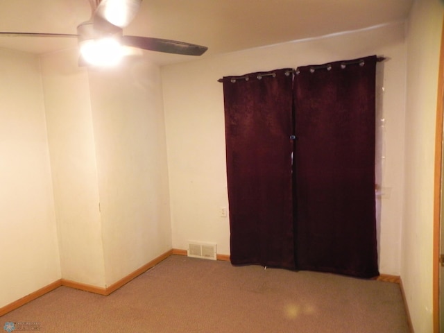 1610 9th St N, Fargo, ND 58102 - unfurnished bedroom featuring light colored carpet and ceiling fan