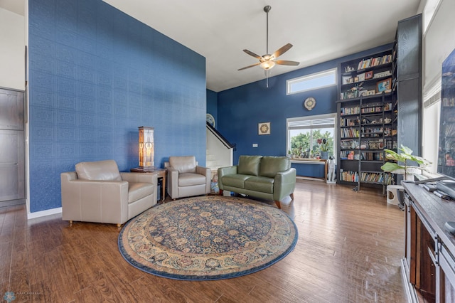 708 30th Ter E, West Fargo, ND 58078 - living room featuring a ceiling fan, wood finished floors, wallpapered walls, and a high ceiling