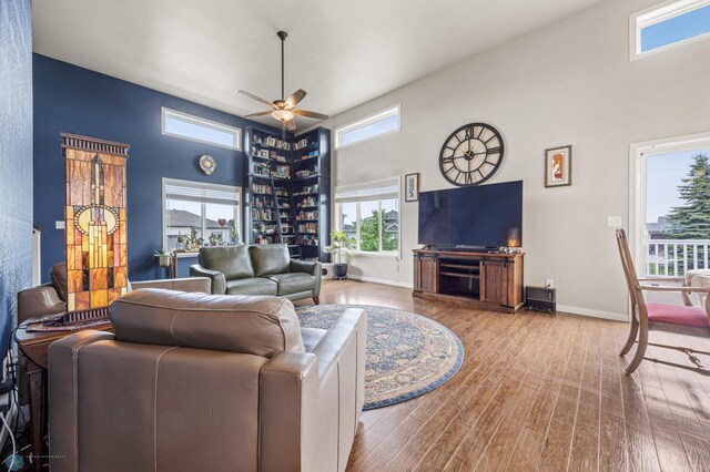 708 30th Ter E, West Fargo, ND 58078 - living room with a towering ceiling, wood finished floors, and ceiling fan
