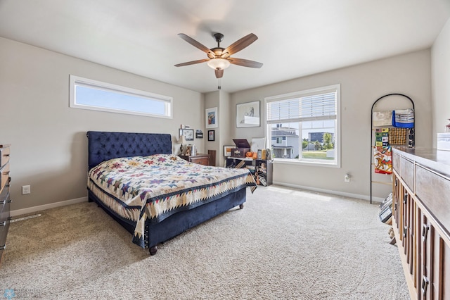 708 30th Ter E, West Fargo, ND 58078 - carpeted bedroom with baseboards and a ceiling fan