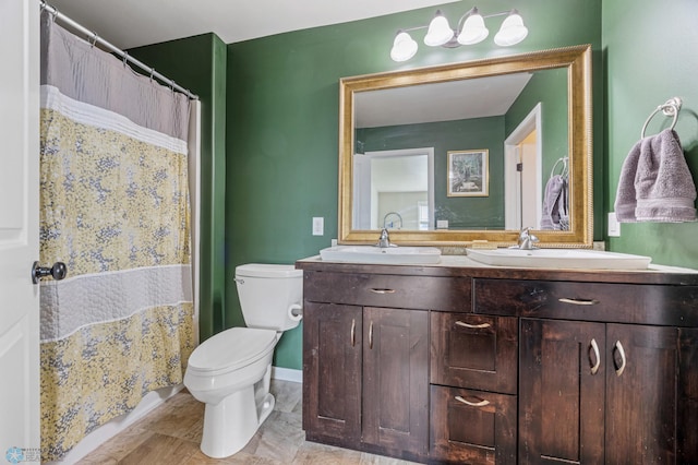 708 30th Ter E, West Fargo, ND 58078 - bathroom featuring toilet and double vanity