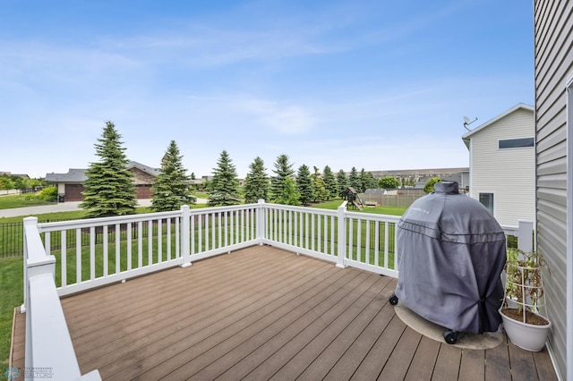 708 30th Ter E, West Fargo, ND 58078 - wooden deck featuring a lawn and a grill