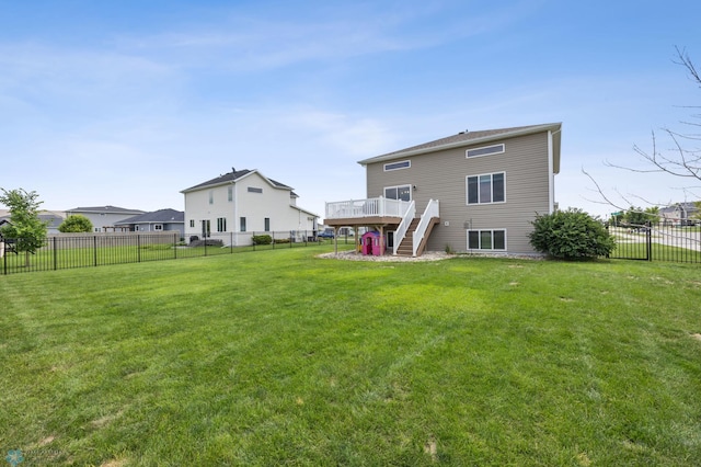 708 30th Ter E, West Fargo, ND 58078 - back of house with stairs, a wooden deck, and a fenced backyard
