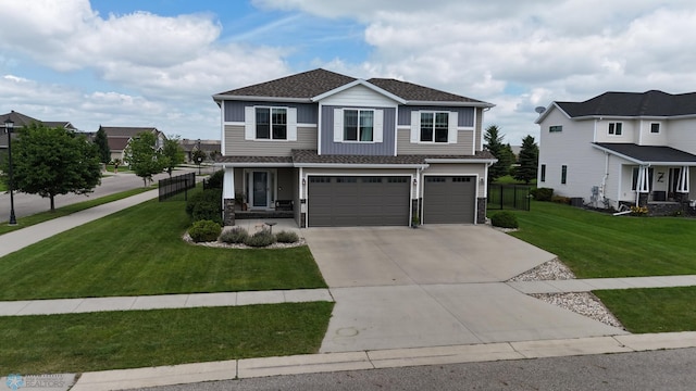 708 30th Ter E, West Fargo, ND 58078 - view of front of house with concrete driveway, a garage, stone siding, and a shingled roof