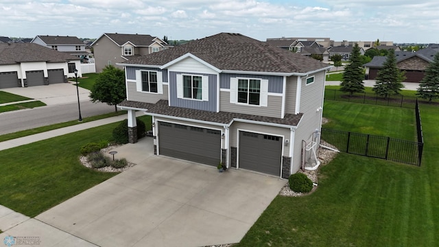 708 30th Ter E, West Fargo, ND 58078 - view of front of home with an attached garage, concrete driveway, roof with shingles, a residential view, and stone siding