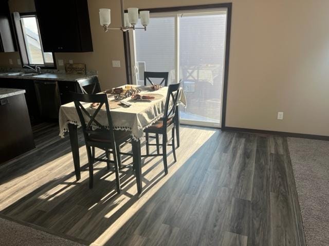 23648 Lily St NW, Saint Francis, MN 55070 - dining area with wood finished floors and a chandelier