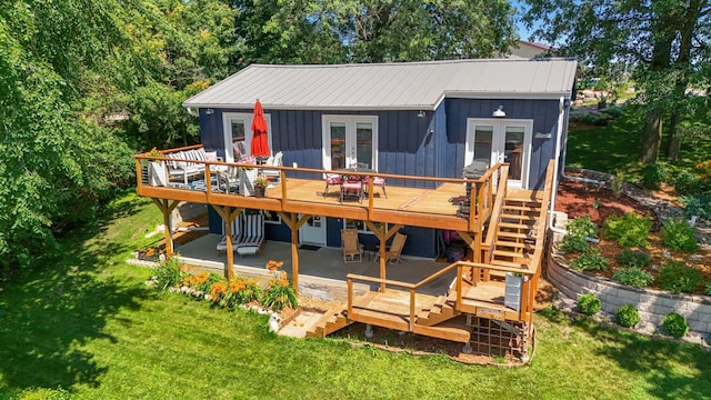 13491 80th St NW, Annandale, MN 55302 - back of property featuring french doors, a deck, stairway, a yard, and a metal roof
