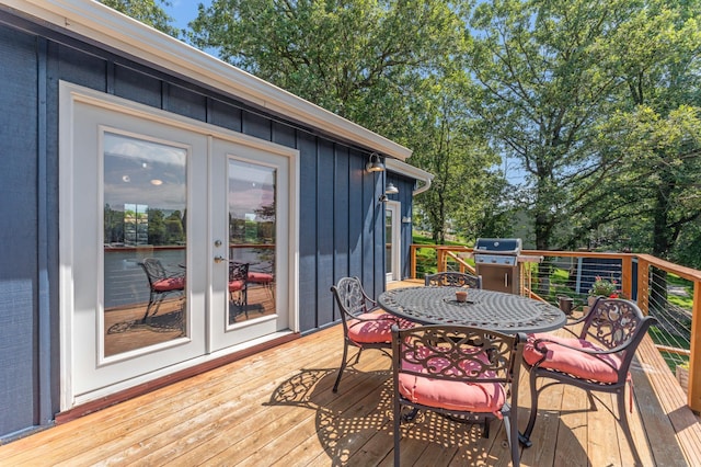 13491 80th St NW, Annandale, MN 55302 - wooden deck with grilling area, outdoor dining area, and french doors