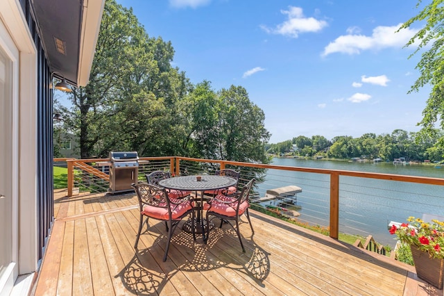 13491 80th St NW, Annandale, MN 55302 - deck featuring a water view, a grill, and outdoor dining area