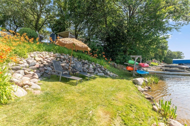 13491 80th St NW, Annandale, MN 55302 - view of green lawn with a water view and a boat dock