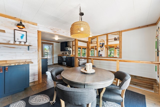 13491 80th St NW, Annandale, MN 55302 - dining room featuring dark wood-type flooring and wood walls