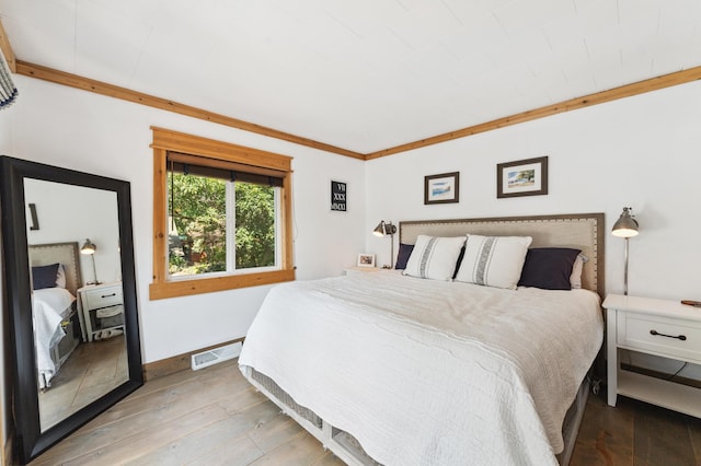 13491 80th St NW, Annandale, MN 55302 - bedroom with wood-type flooring and baseboards