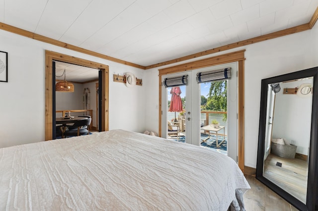 13491 80th St NW, Annandale, MN 55302 - bedroom featuring wood finished floors, access to exterior, french doors, and ornamental molding