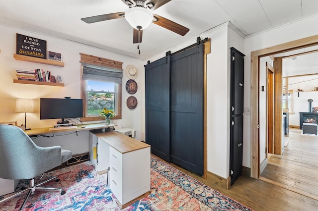 13491 80th St NW, Annandale, MN 55302 - office featuring ceiling fan, light wood-type flooring, and a barn door