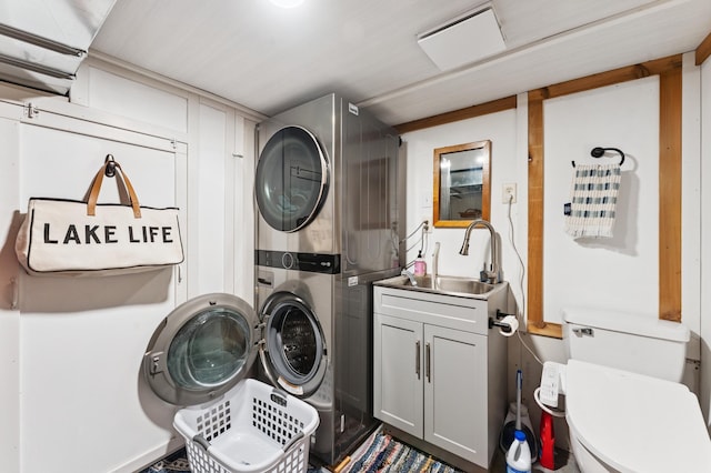 13491 80th St NW, Annandale, MN 55302 - laundry room with stacked washer / drying machine and cabinet space
