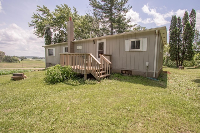 N6050 270th St, Lucas Twp, WI 54751 - rear view of house with a wooden deck, a yard, and crawl space