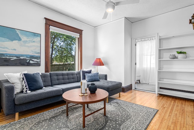 1066 Woodbridge St, Saint Paul, MN 55117 - living area with hardwood / wood-style flooring, a textured ceiling, and a ceiling fan