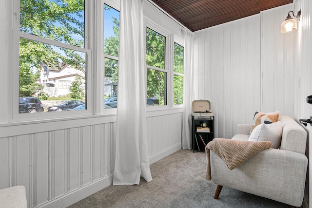 1066 Woodbridge St, Saint Paul, MN 55117 - sitting room featuring carpet floors and wooden walls
