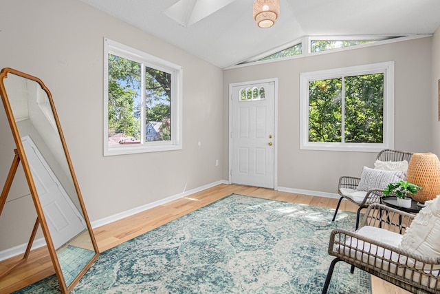 1066 Woodbridge St, Saint Paul, MN 55117 - entrance foyer featuring a skylight, wood finished floors, and vaulted ceiling