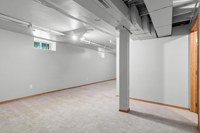 1066 Woodbridge St, Saint Paul, MN 55117 - below grade area featuring carpet and baseboards