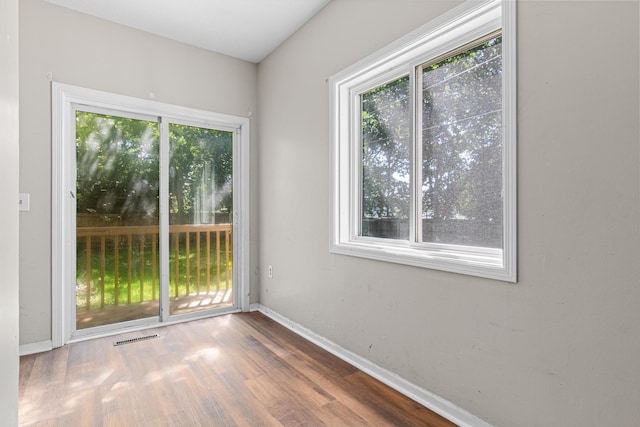 1066 Woodbridge St, Saint Paul, MN 55117 - empty room featuring healthy amount of natural light and wood finished floors