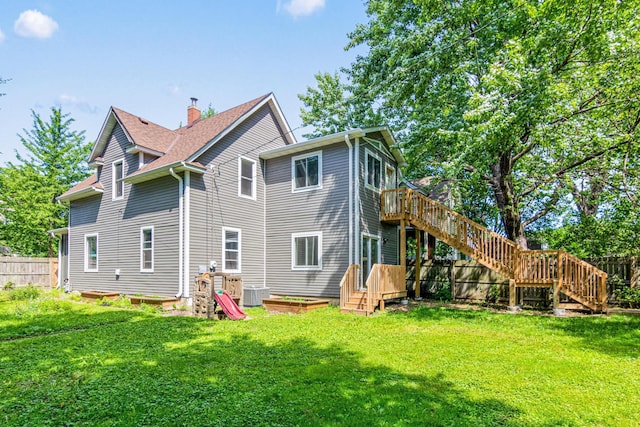 1066 Woodbridge St, Saint Paul, MN 55117 - back of house with stairway, a wooden deck, and a chimney