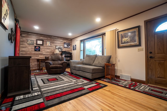 1606 5th St N, Fargo, ND 58102 - living room with an accent wall, wood finished floors, recessed lighting, and wooden walls