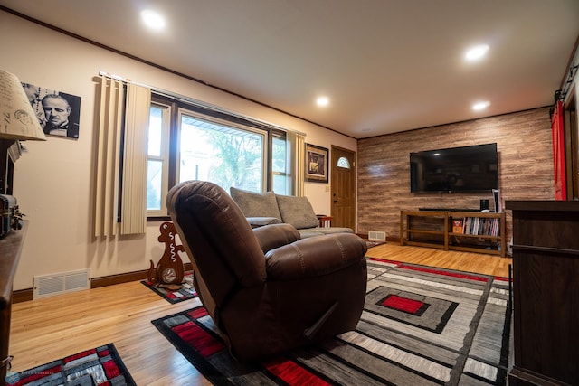 1606 5th St N, Fargo, ND 58102 - living area featuring wood finished floors, recessed lighting, and wooden walls