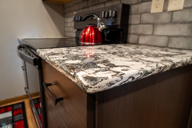 1606 5th St N, Fargo, ND 58102 - kitchen view of range with electric stovetop and tasteful backsplash