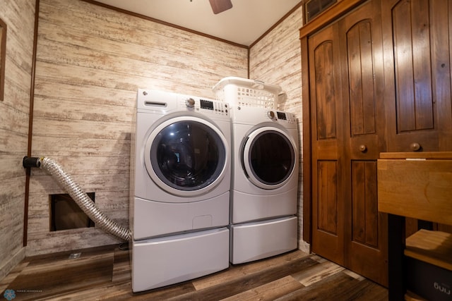 1606 5th St N, Fargo, ND 58102 - laundry room featuring wood walls, washing machine and dryer, wood finished floors, a ceiling fan, and ornamental molding
