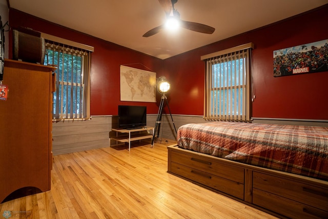 1606 5th St N, Fargo, ND 58102 - bedroom with wood finished floors, a baseboard heating unit, and ceiling fan