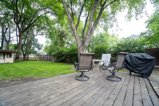 1606 5th St N, Fargo, ND 58102 - wooden terrace featuring a fenced backyard and grilling area