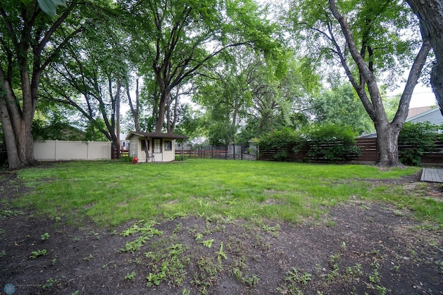 1606 5th St N, Fargo, ND 58102 - fenced backyard with an outdoor structure
