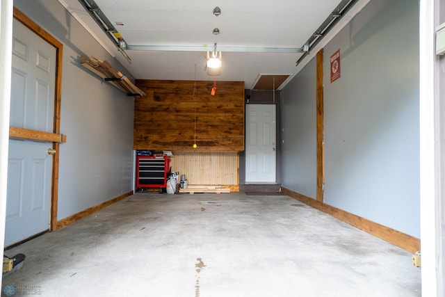 1606 5th St N, Fargo, ND 58102 - garage featuring baseboards and a garage door opener